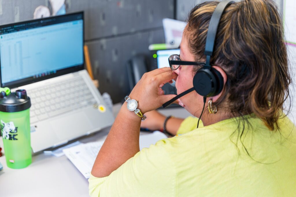 Our Konnection interpreter on a phone interpreting call at the Wyomissing, PA office